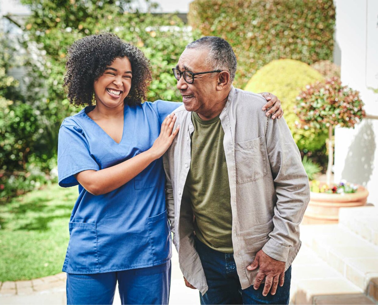 Caregiver engaging with senior male patient